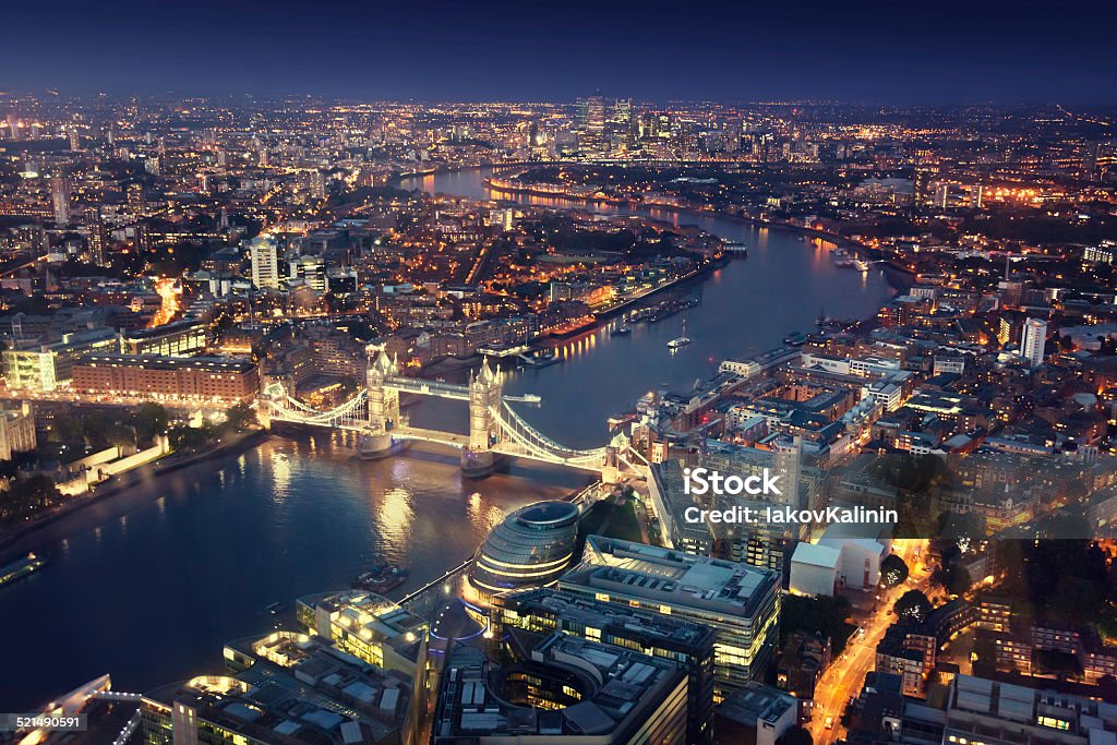 London at night with urban architectures and Tower Bridge